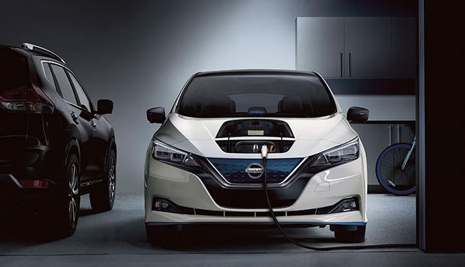 white nissan ev charging