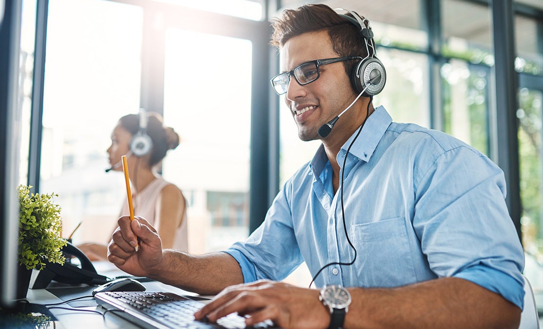 man attending call using headphones